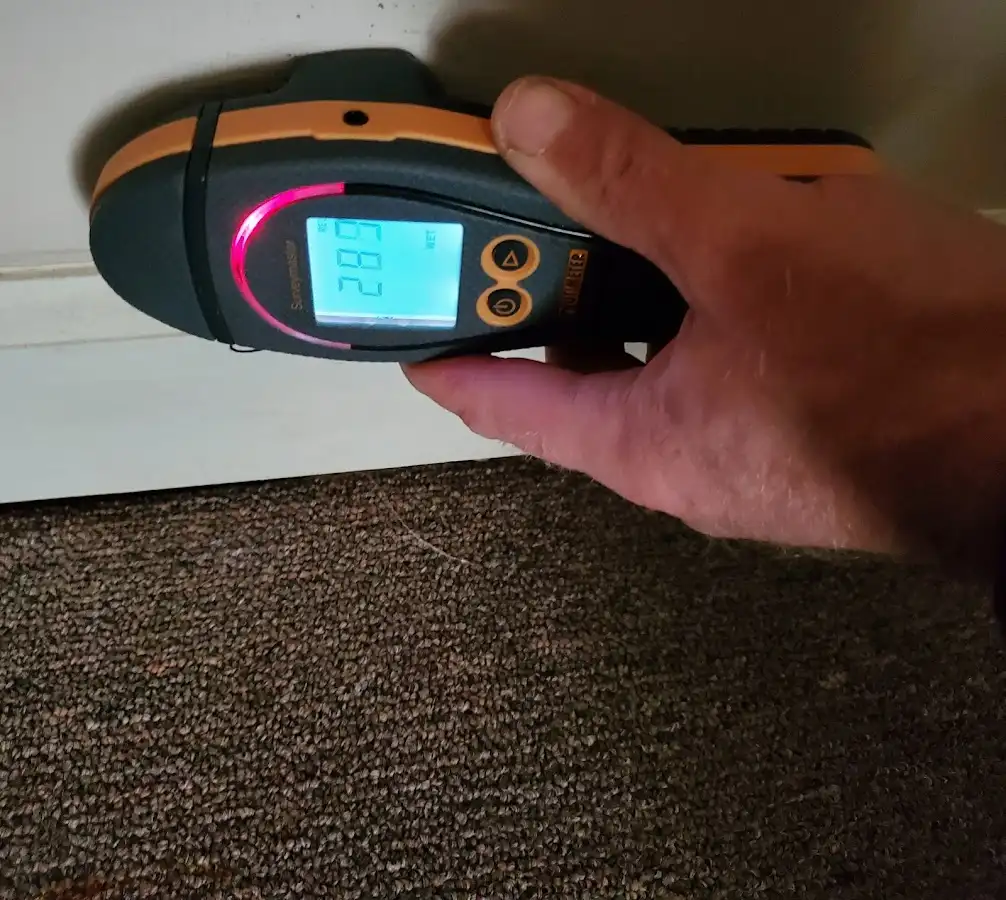 Moisture detection at baseboard during Storm Damage Restoration in Acushnet